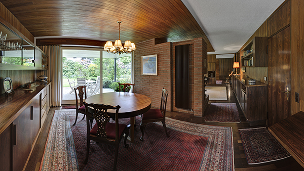 The dining room - a large sliding door provides access to the veranda and garden